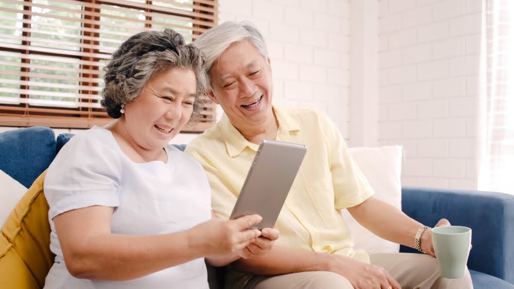 asian-elderly-couple-using-tablet-drinking-coffee-living-room-home-couple-enjoy-love-moment-while-lying-sofa-when-relaxed-home (1) asian-elderly-couple-using-tablet-drinking-coffee-living-room-home-couple-enjoy-love-moment-while-lying-sofa-when-relaxed-home (1)
